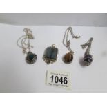 4 silver pendants set different coloured stones including tiger's eye (3 on chains).
