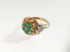 An 18ct gold and green stone ring (possibly jade), size J.
