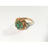 An 18ct gold and green stone ring (possibly jade), size J.