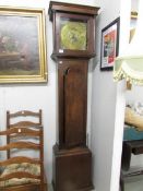 A long case clock with brass face by John Boot,