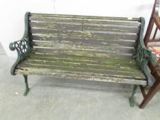 A metal and wood garden bench.