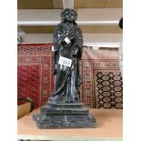 A Victorian cast iron figural door stop.