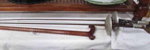 2 fencing foils marked 'Leon Paul' and a walking stick featuring oriental script to shaft