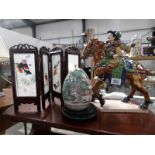 A Tang horse, a painted Chinese egg on stand and a Chinese silk embroidered screen.