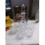 A fine quality crystal decanter and a set of 6 matching glasses.