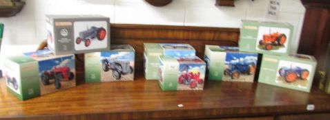 8 boxed Universal Hobbies tractor's.