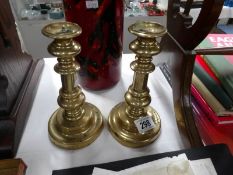A pair of Georgian brass candlesticks.