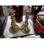 A pair of Georgian brass candlesticks.