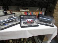 3 Franklin Mint model cars with certificates and in display cases.