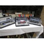 3 Franklin Mint model cars with certificates and in display cases.