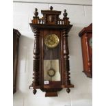 A mahogany Vienna wall clock.