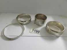 A Charles Horner silver bangle, a silver engraved bangle dated 1934 and 2 further silver bangles,