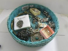 A large quantity of jewellery including some silver, assorted earrings, brooches etc.