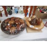 2 bowls of carved wood fruit and eggs.