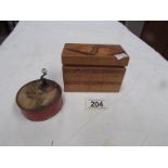 An early 20th century hand wind music box and an inlaid box containing playing cards.