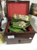 A Mahogany box containing Masonic sash.