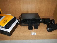 A Kodak instant camera and a pair of binoculars.