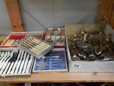 A shelf of assorted cutlery.