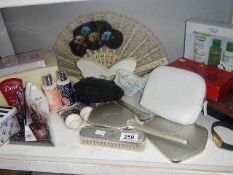 A shelf of vanity items etc.