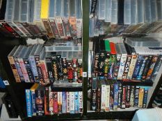 A shelf of assorted videos.