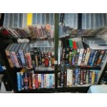 A shelf of assorted videos.