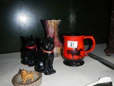 A Sylvac tankard, a Wade pin dish, 2 black cats and a vase.