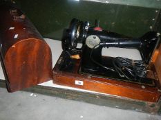 An electric table top sewing machine.