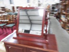 A mahogany framed mirror.