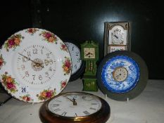 A Royal Albert Old Country roses wall clock and 5 other clocks.