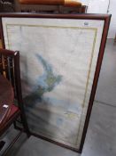 A framed and glazed map of New Zealand.