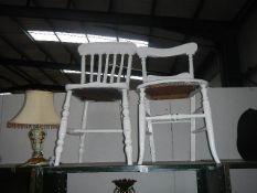 An old painted slat back chair and a painted bedroom chair.