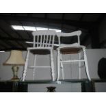 An old painted slat back chair and a painted bedroom chair.