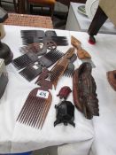 A collection of African/Tribal combs and wooden items.