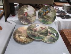5 collector's plated depicting birds.