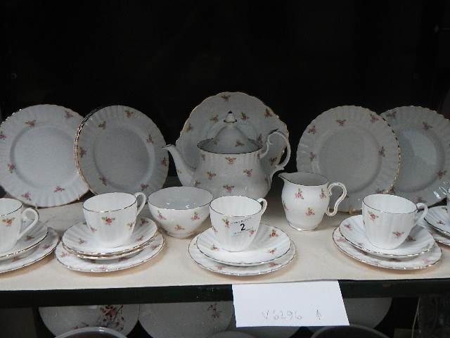 24 pieces of bone china rose decorated tea ware.