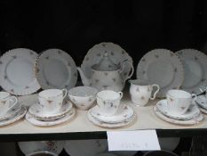 24 pieces of bone china rose decorated tea ware.
