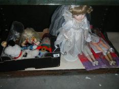 A shelf of dolls and soft toys.