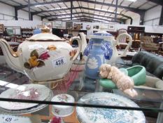 A crinoline lady teapot, a 1950's Sadler teapot etc.