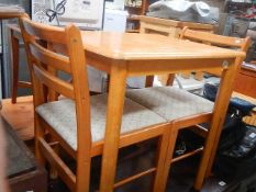 A table and 2 chairs,