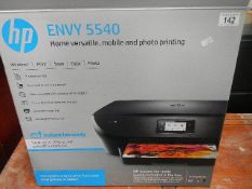 A boxed HP Envy 5540 printer.