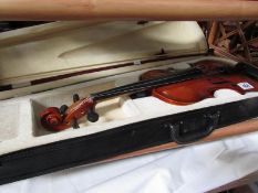 A modern violin in case.