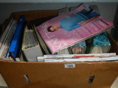 A box of assorted knitting patterns.