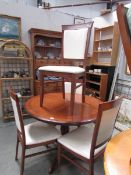 A mahogany dining table and 4 chairs.