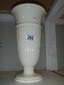 A white Wedgwood vase.