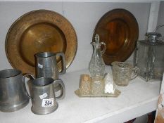 A shelf of miscellaneous including tankards, brass trays etc.