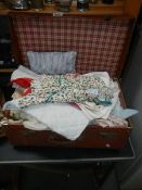 A suitcase of textiles,.