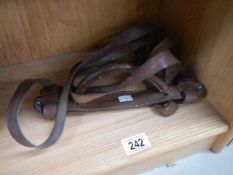 A set of leather horse training reins,