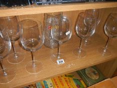 A quantity of wine glasses.