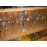 A quantity of wine glasses.