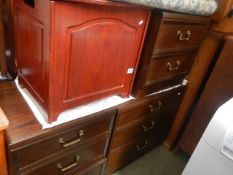 A 3 drawer chest, a pair of matching bedside chests and a linen bin.